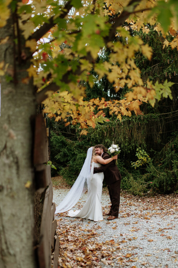 Bride and groom hugging privately after their ceremony