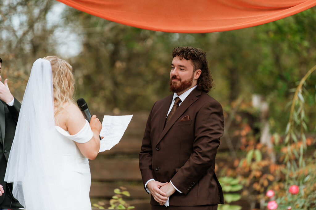 Bride reading her vows to the groom