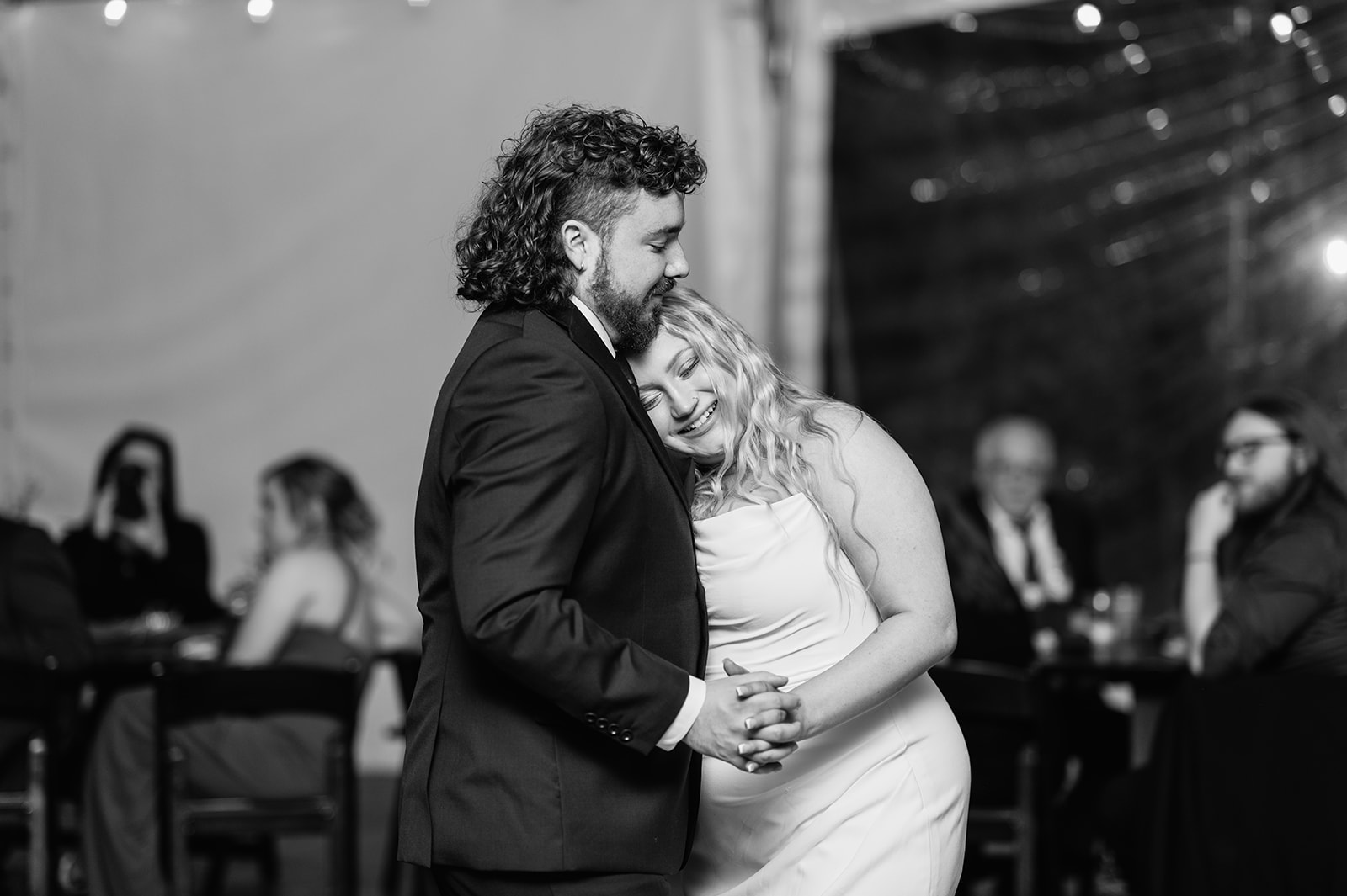 Black and white photo of a bride and grooms first dance