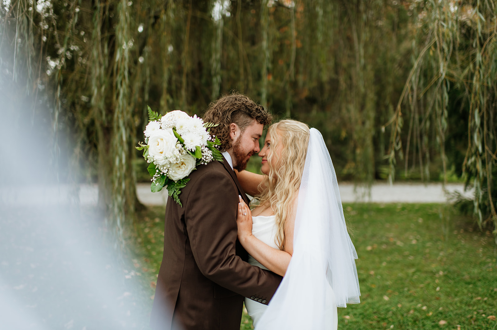 Outdoor bride and groom portraits from a Willow Acres wedding in Middletown, Indiana