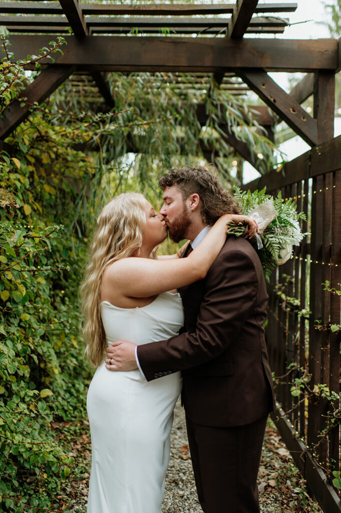 Bride and grooms portraits at Willow Acres wedding venue at their "wedding wall"