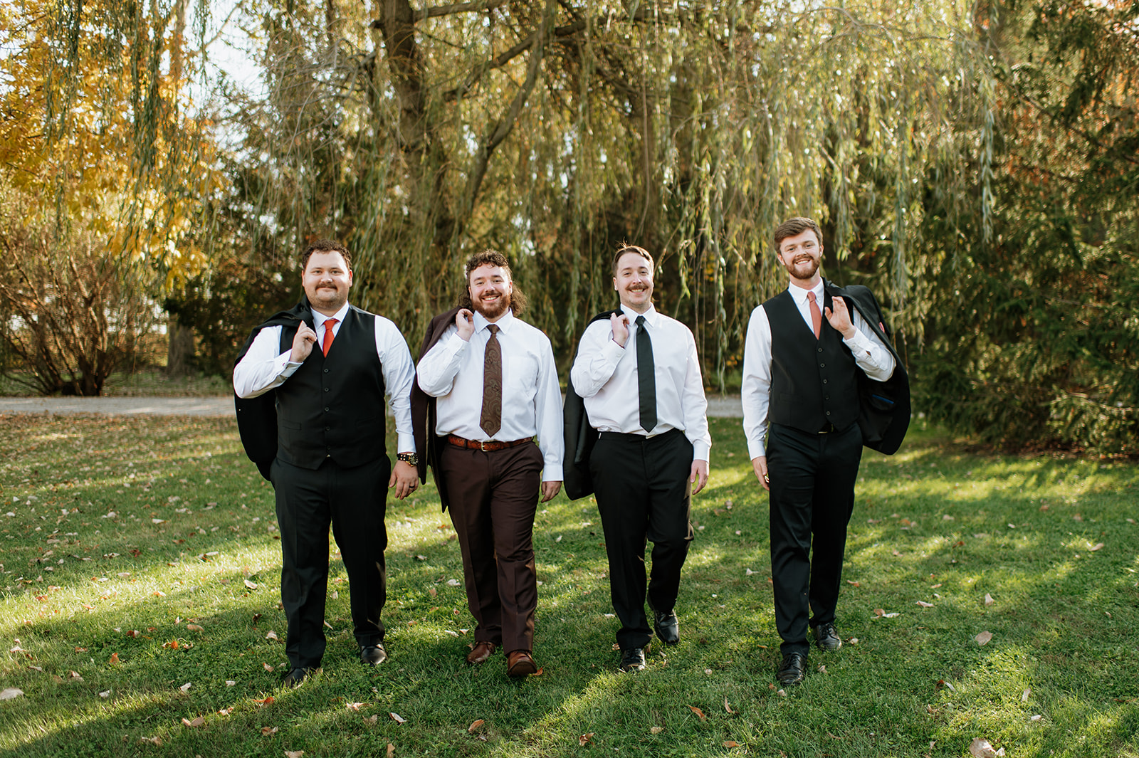 Outdoor groom and groomsmen portraits from a Willow Acres wedding in Middletown, Indiana