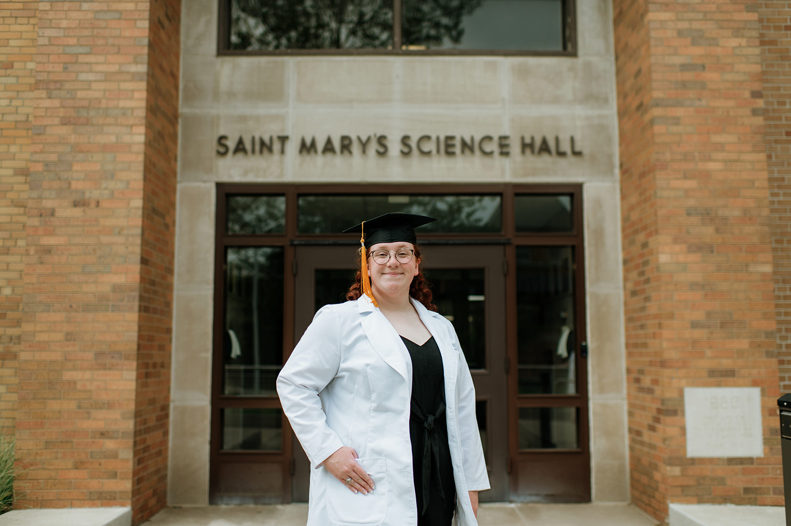 Graduate posing for her graduation photos