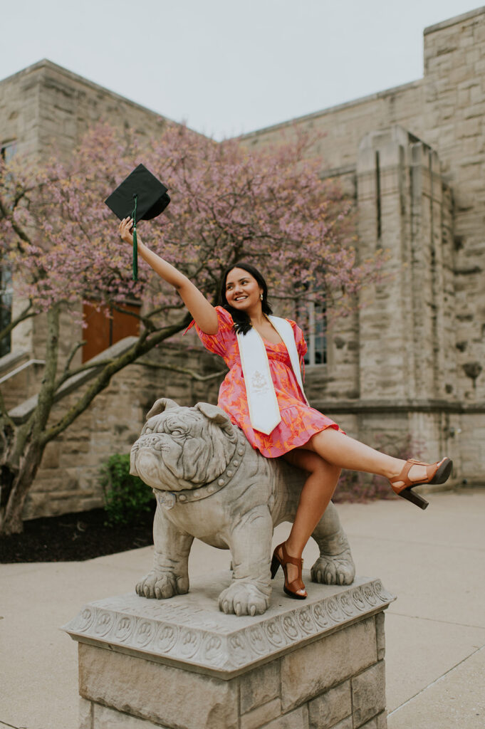 Girl posing with her school mascot for her Northern Indiana graduation photos