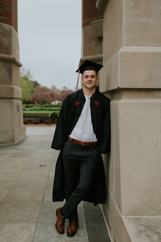 Man posing for his graduation photos 