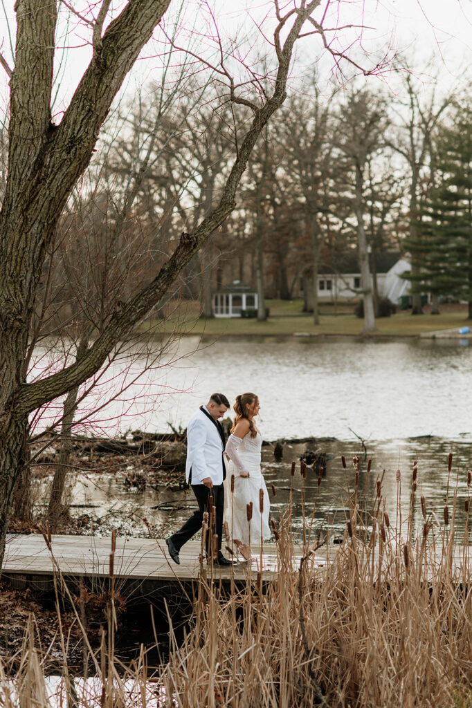 Bride and groom walking back to their wedding venue - The Allure on The Lake