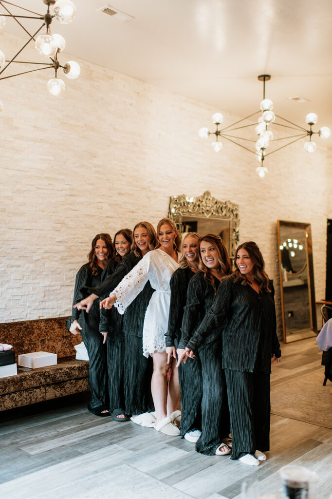 Bride and bridesmaids posing for photos