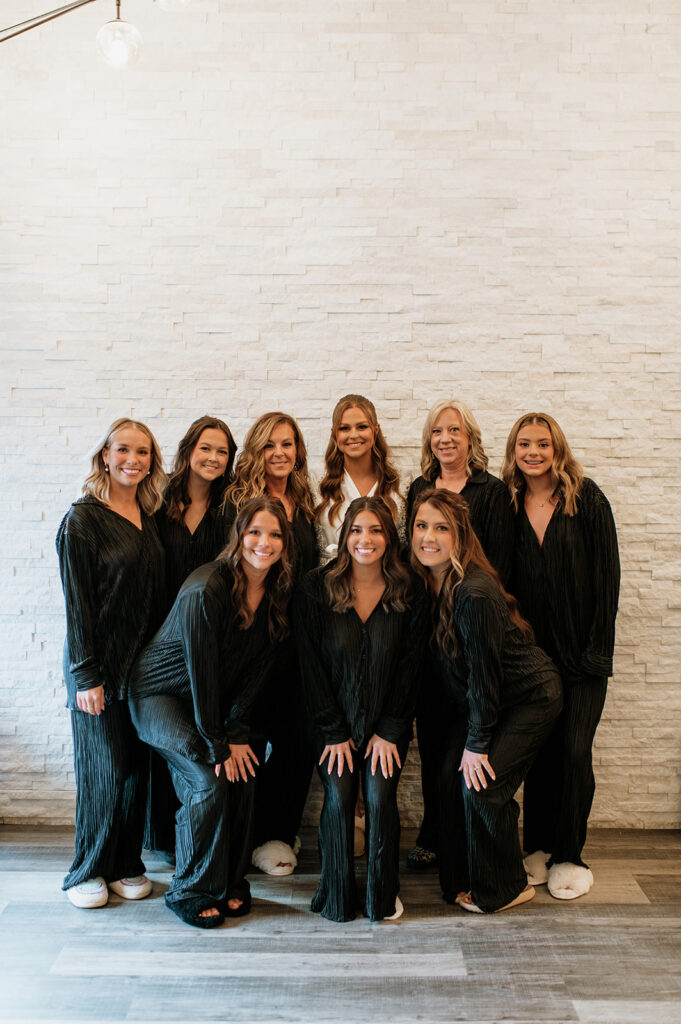 Bride and bridesmaids posing for photos in pajamas