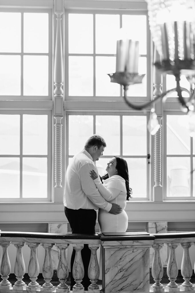 Black and white photo of a couple posing at Morris Performing Arts Center in South Bend, Indiana