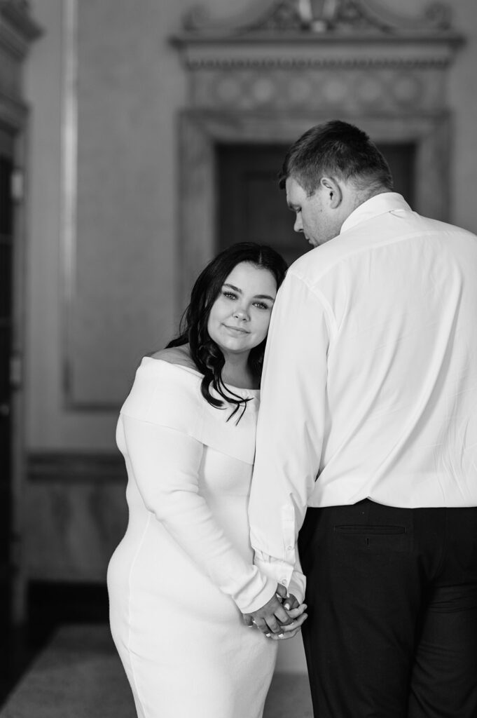 Black and white photo of a couple posing for their engagement