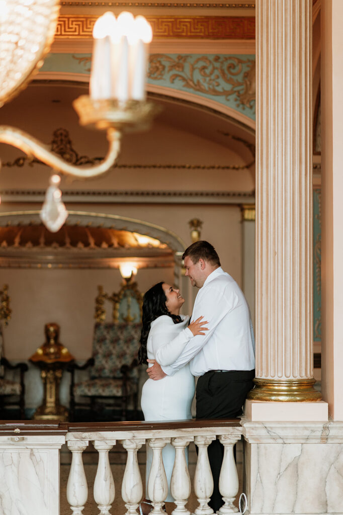 Couple posing for engagement photos at the Morris Performing Arts Center