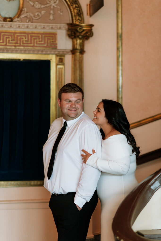 Couple posing at The Morris Performing Arts Center for their engagement session