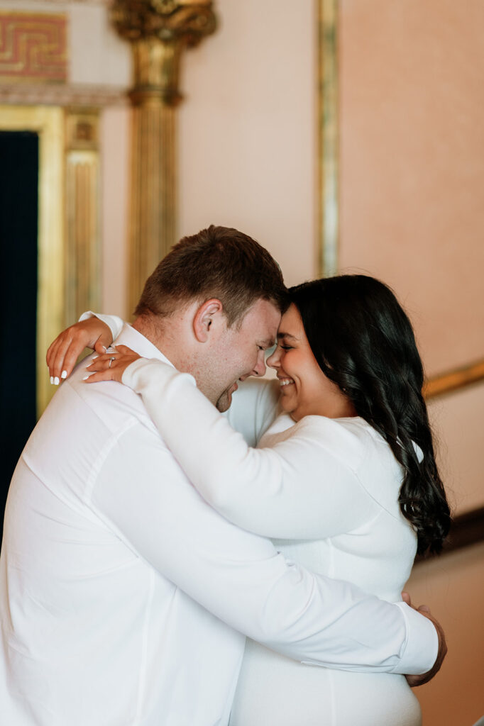Couple touching foreheads and smiling during their South Bend engagement session