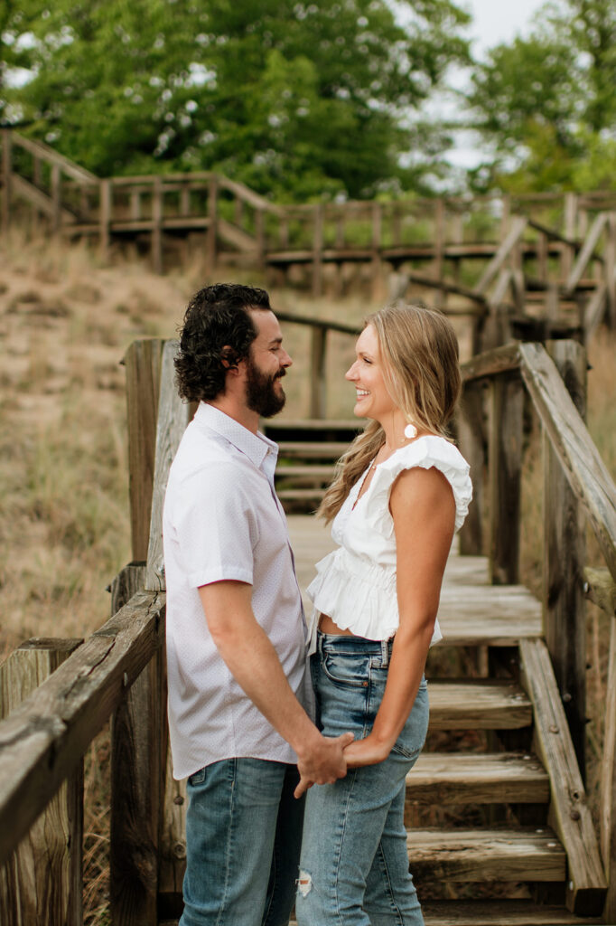 Couple posing for their summer engagement photos in Indiana