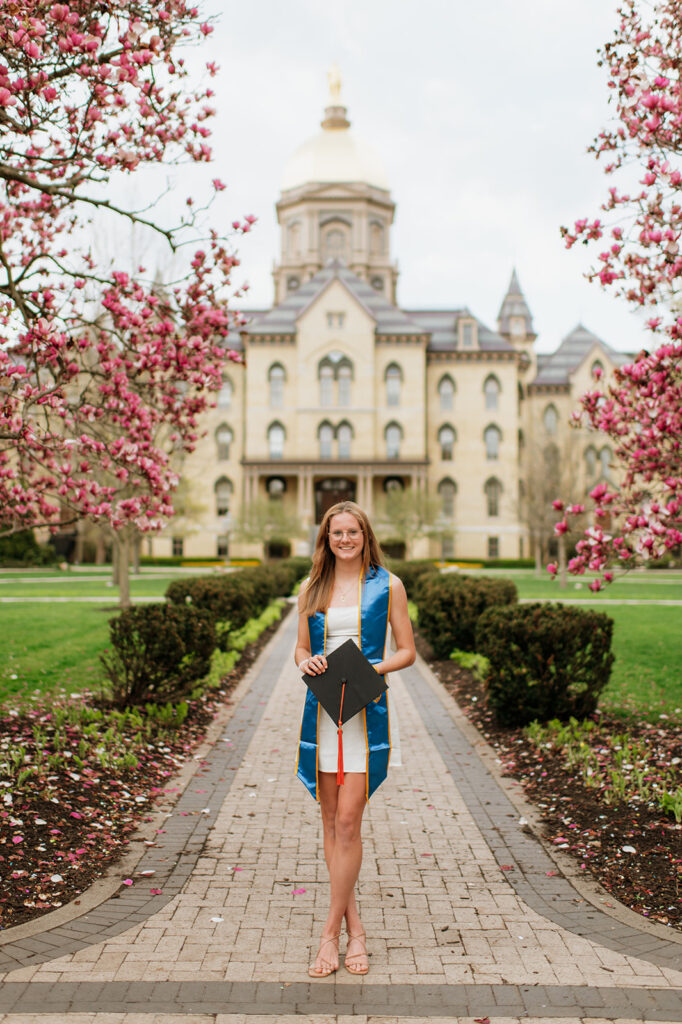 Grad posing in front of The Golden Dome