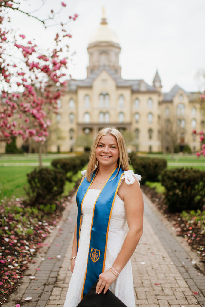 Woman posing in front of The Golden Dome