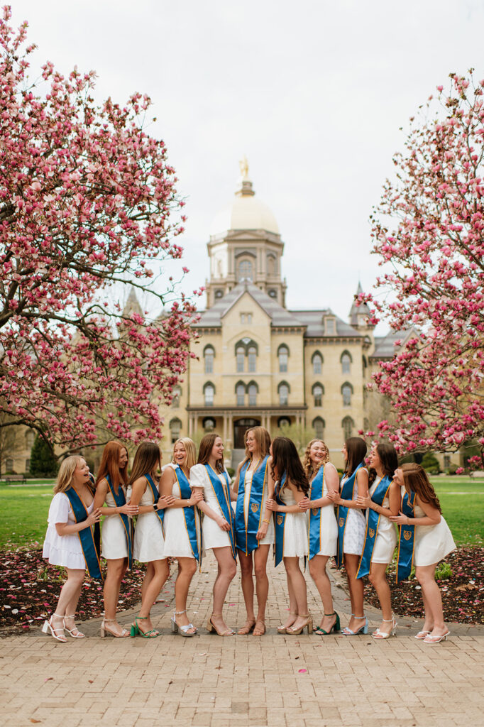 University of Notre Dame grad photos in front of The Golden Dome