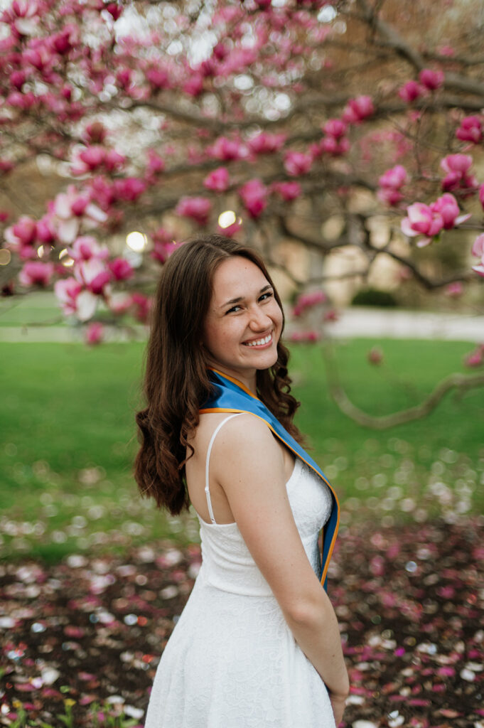 Grad posing on campus