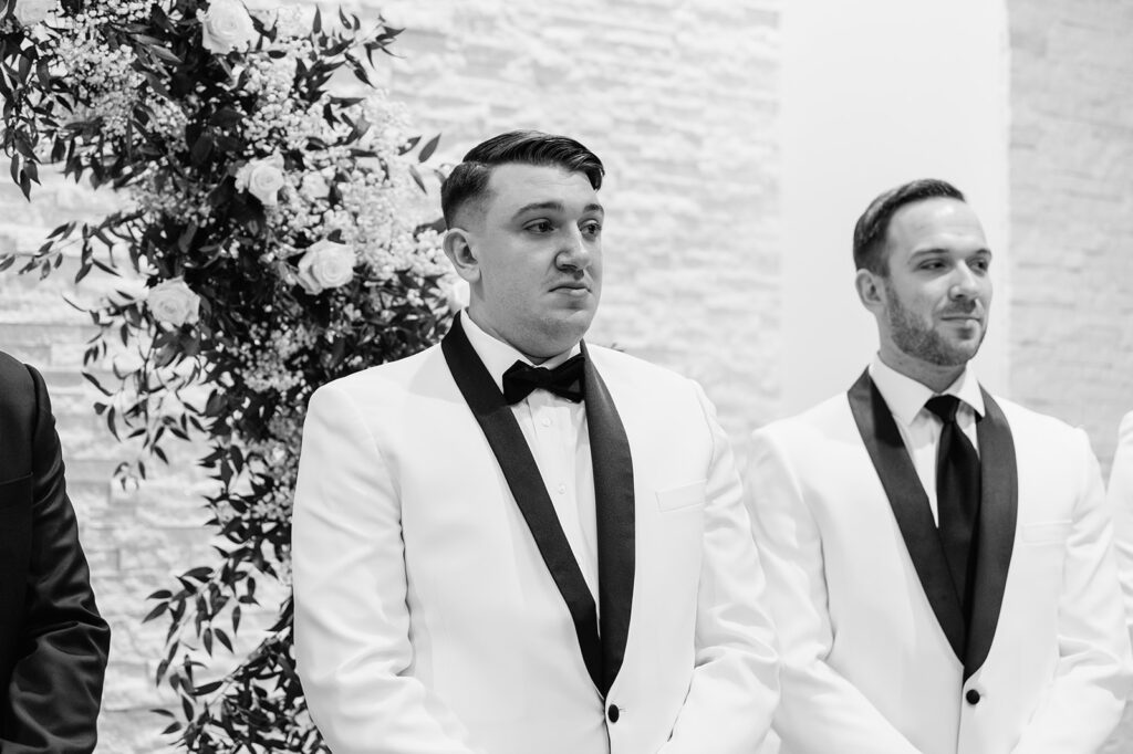 Groom getting emotional seeing his bride walking down the aisle