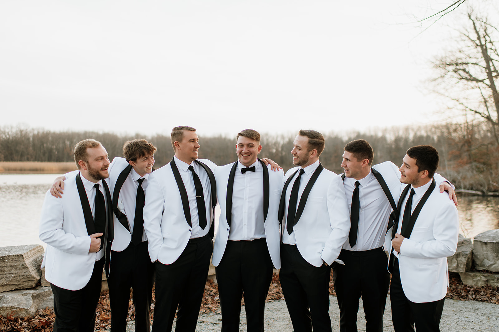 Outdoor groom and groomsmen photos from a winter wedding at The Allure on The Lake in Chesterton, Indiana