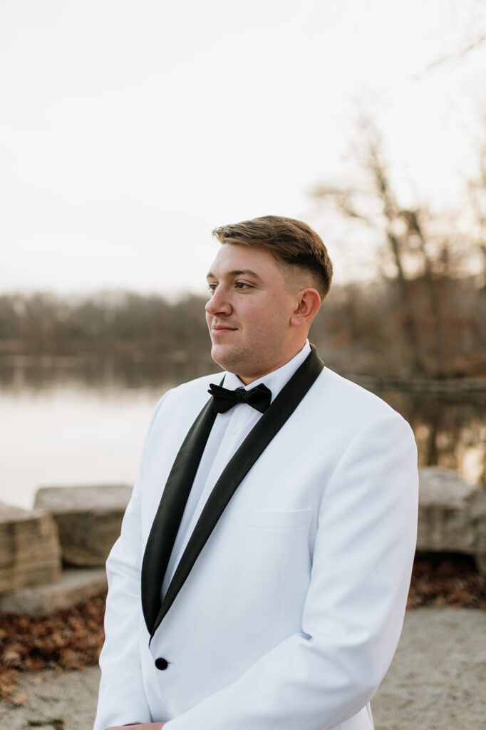 Outdoor grooms portraits from a winter Allure on The Lake wedding