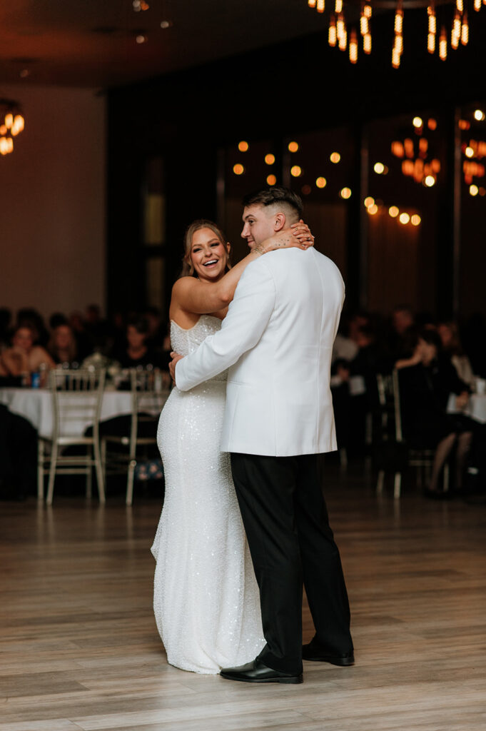 Bride and groom sharing their first dance during their Allure on The Lake wedding reception
