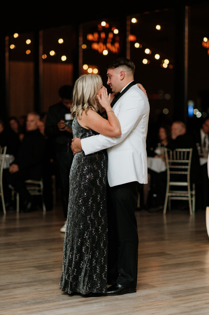 Groom sharing an emotional dance with his mother