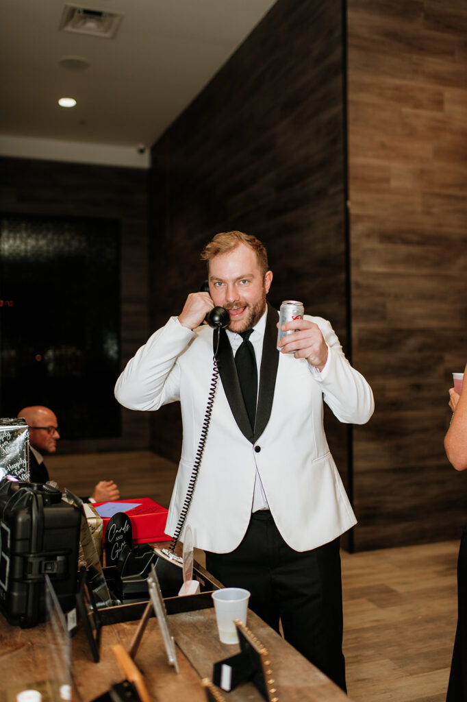 Groomsmen leaving a message on a phone book