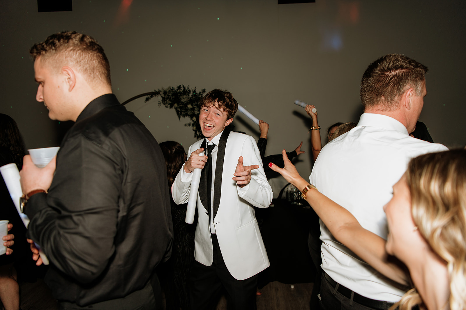 Groomsmen dancing during the reception