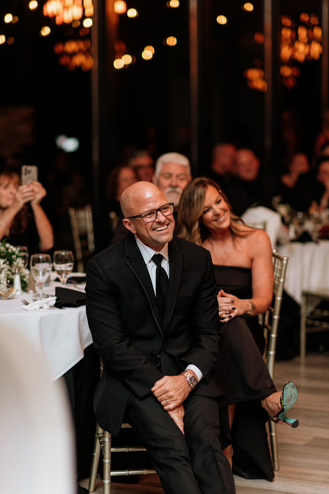 Brides father smiling during speeches