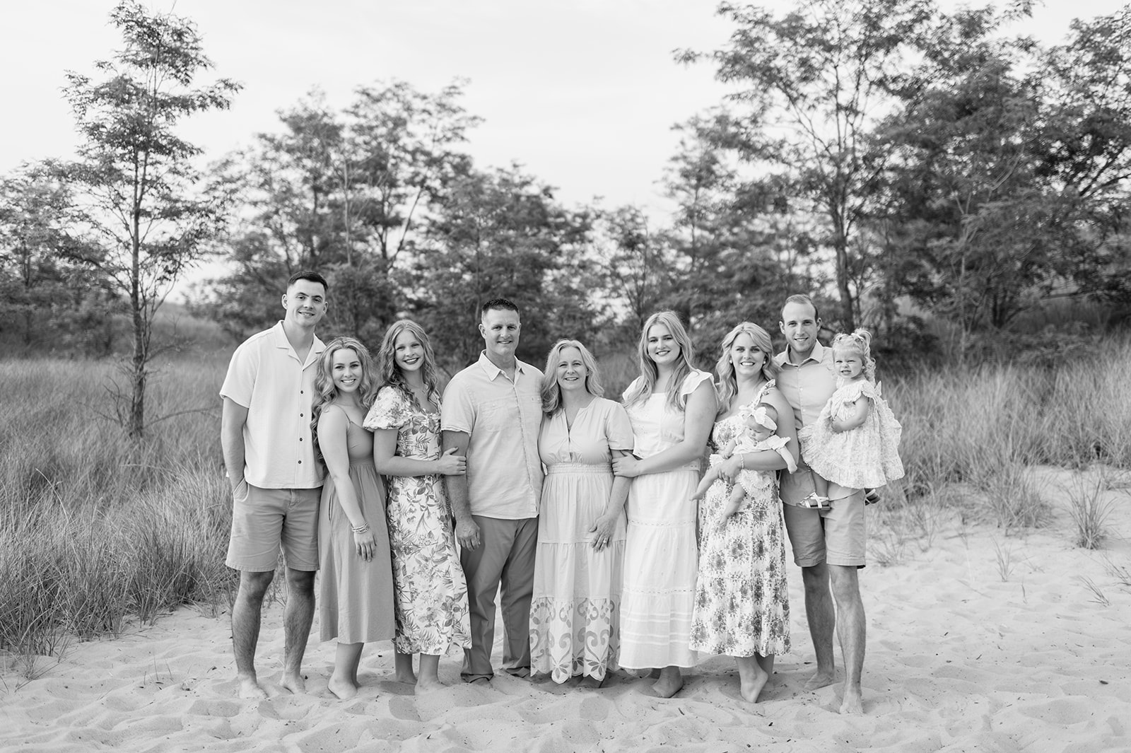 Black and white extended family photo at New Buffalo Beach in Michigan
