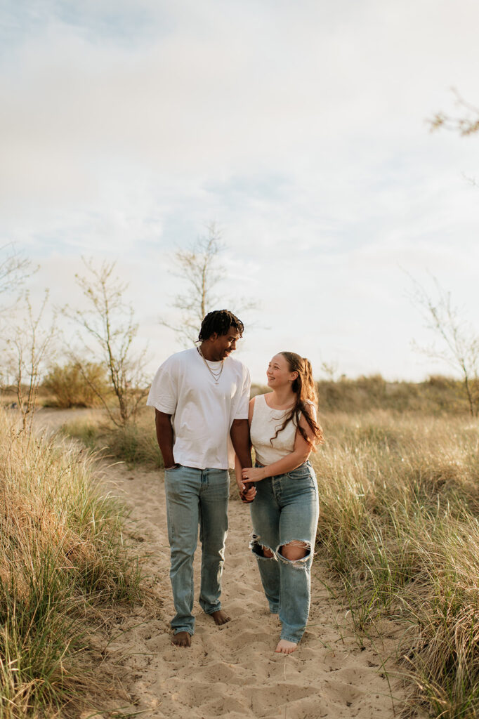 Couple walking the beach trails in New Buffalo, Michigan