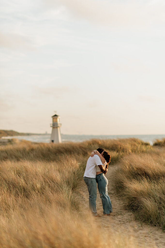 Couple hugging on the beach in New Buffalo, Michigan