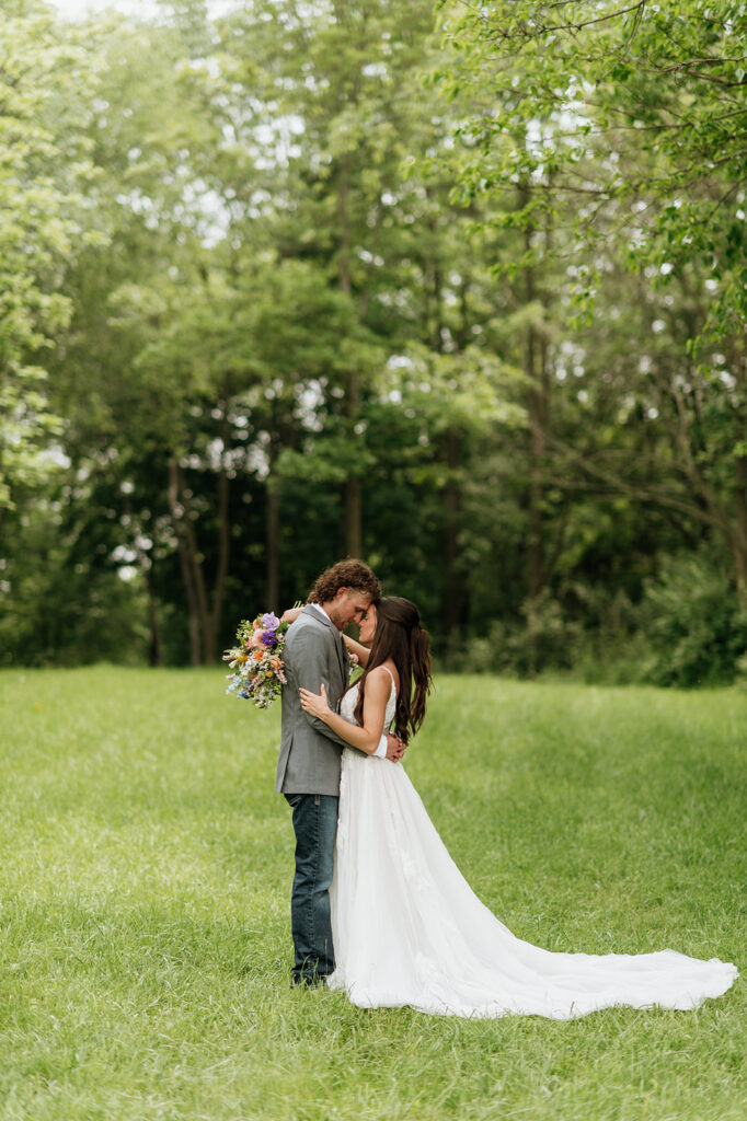 Bride and grooms outdoor portraits on the property of 5c Farms - Premier Indiana barn wedding venue