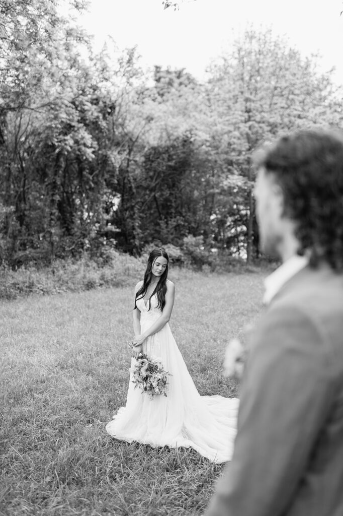 Editorial wedding photo of a bride and groom posing outside