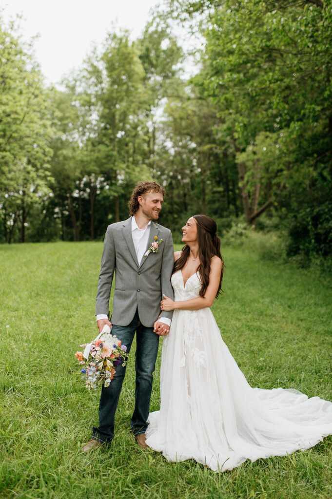 Bride and groom posing outside