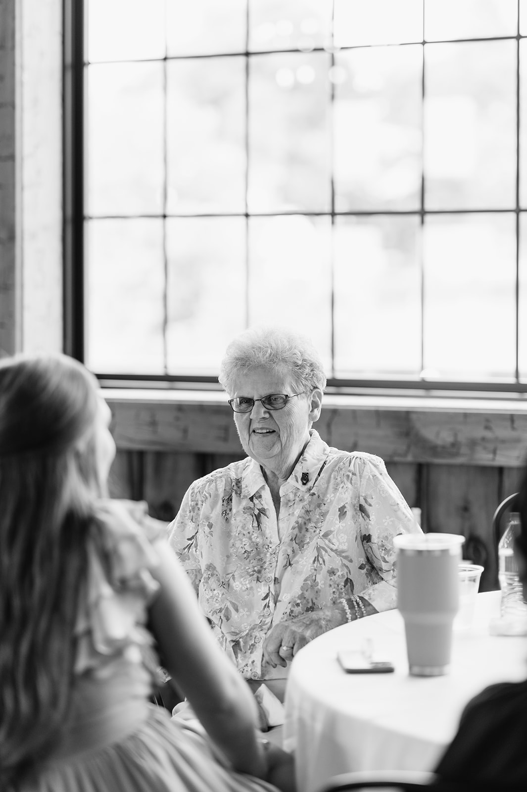 Black and white photo of a family member during the reception