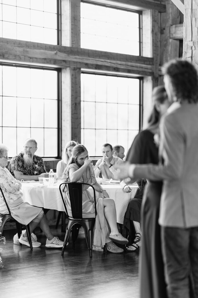 Guests getting emotional as the groom shares a dance with his mother