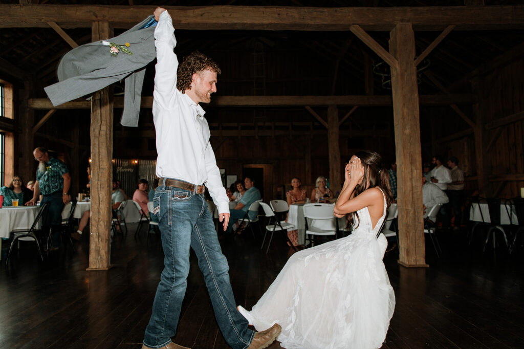 Groom dancing in front of the bride