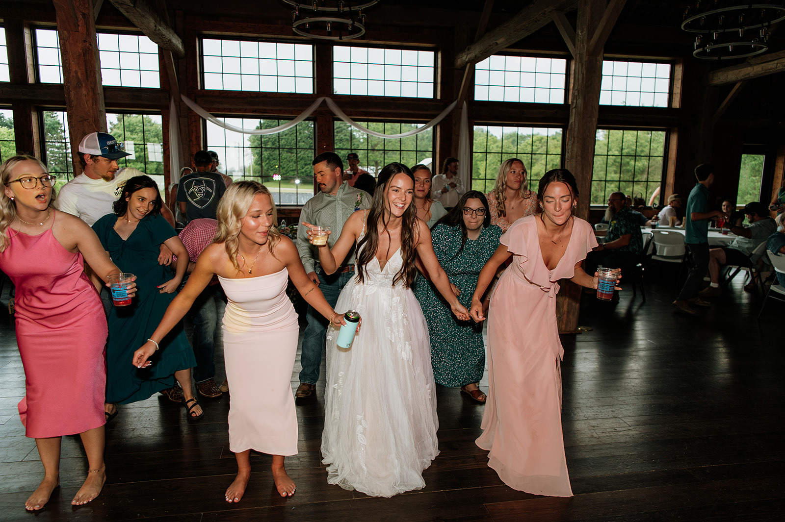 Bride dancing with guests during the reception