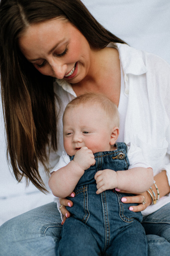 Close up shot of a mom holding her baby during their simple outdoor Chicago family photography session