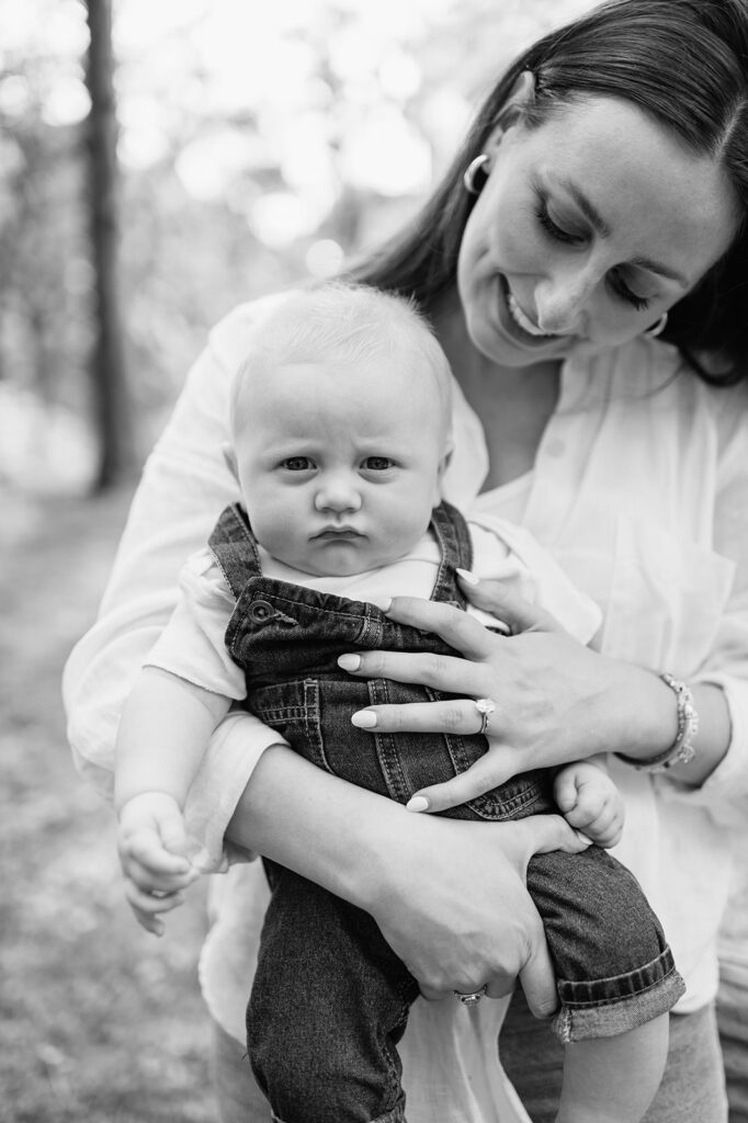 Close up black and white photo of a mother holding her newborn son during their Chicago family photography session