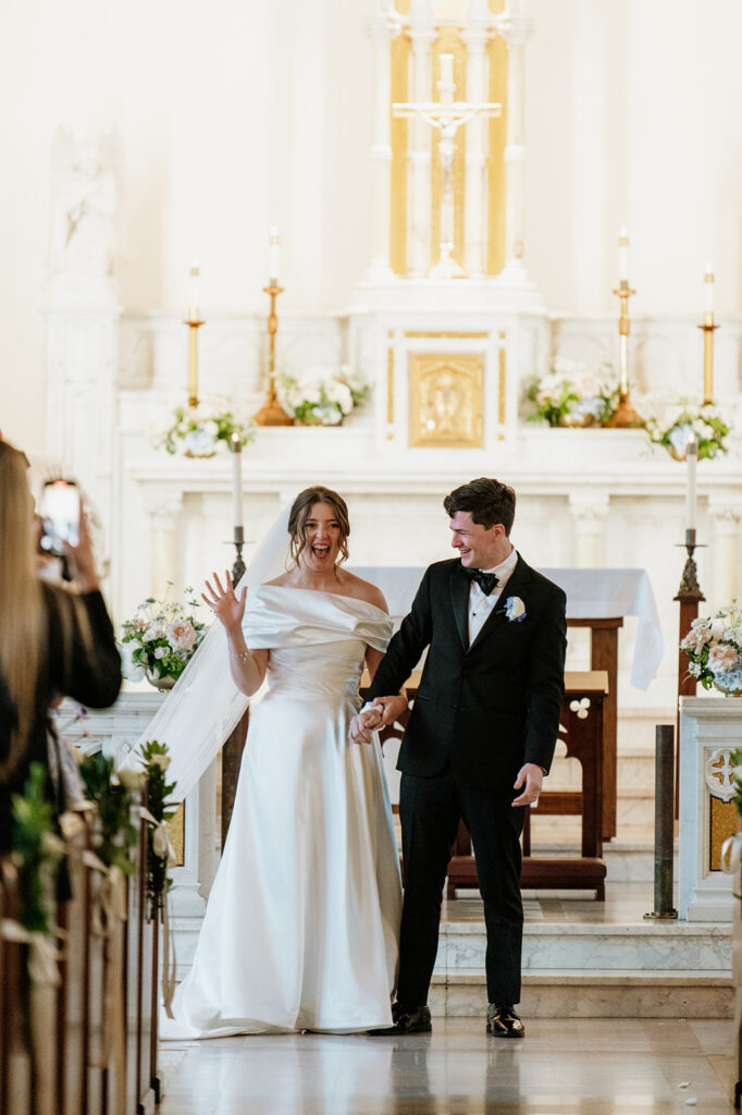 Bride and groom celebrate after their first kiss, now husband and wife