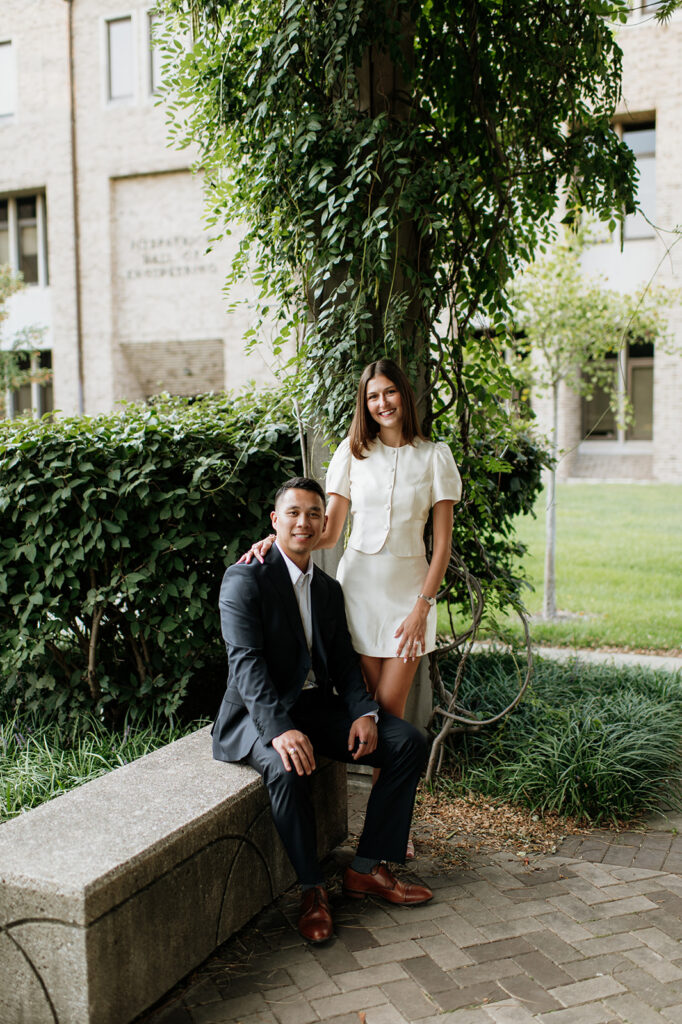 Couple posing by a bench at Notre Dame University