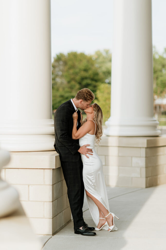 Couple sharing a kiss at the Elkhart County Courthouse during their engagement session