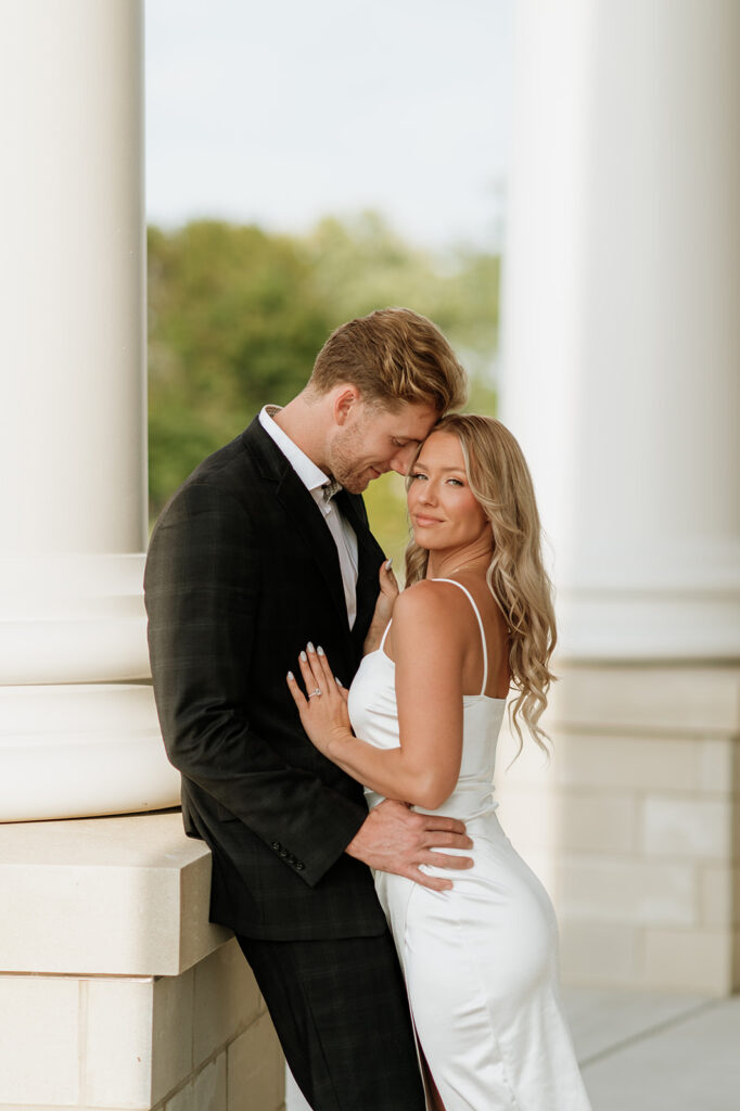 Couple posing for their Goshen, Indiana engagement photos at the courthouse