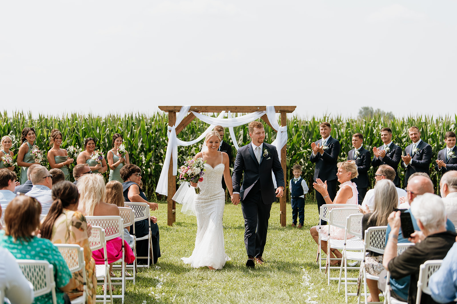 Couple walking back down the aisle after ceremony at Rock Run Creek Barn.