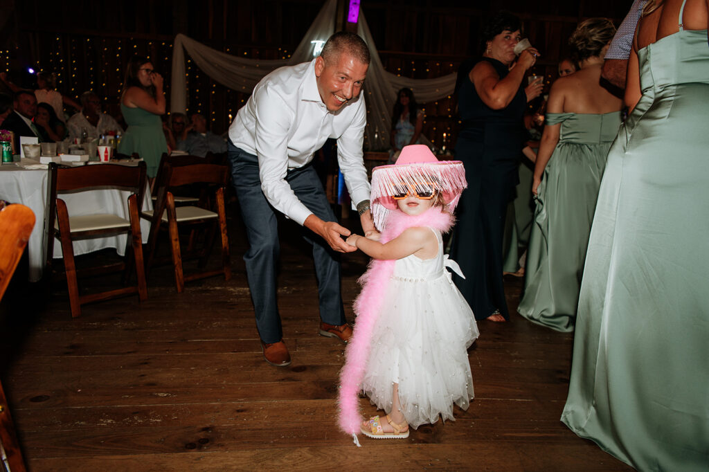 Man dancing with little girl