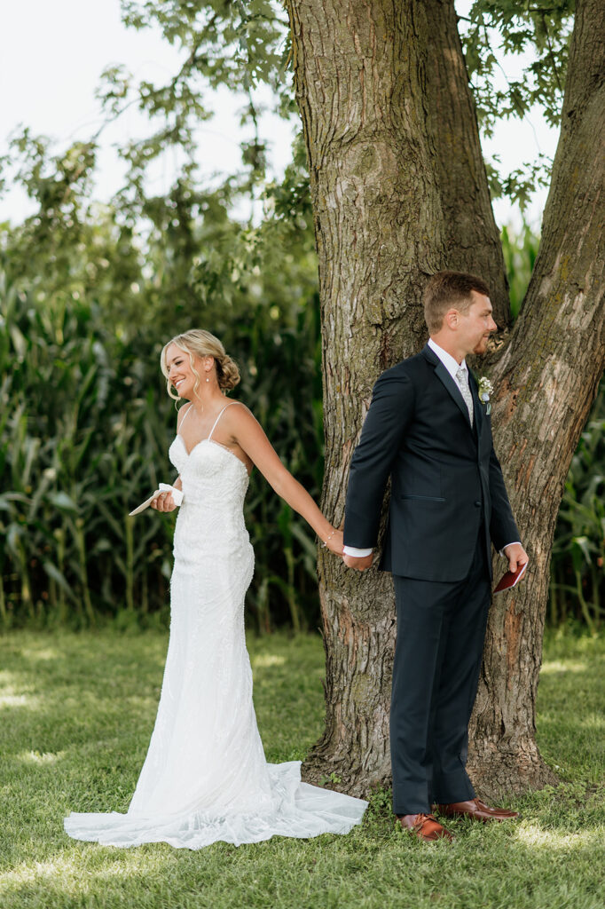 Couple holding hands during private vows at Rock Run Creek Barn wedding.