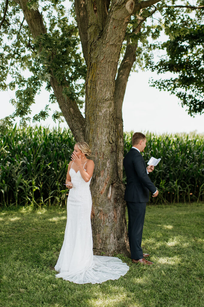 Bride getting emotional as the groom reads his vows to her